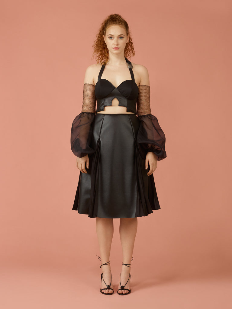 Separate un-attached belle sleeves with metallic fishnet fitted on top and transparent black organza on bottom half. Paired with black vegan leather bralette and black vegan leather flared a-line skirt.