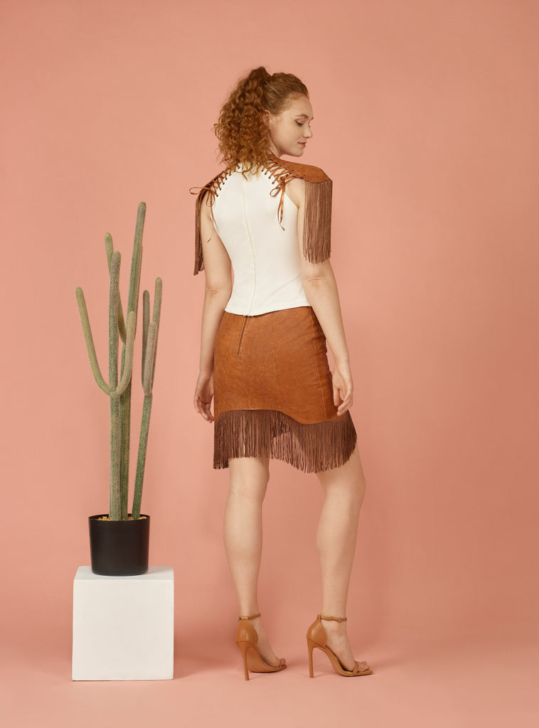 Back view of brown fringe mini skirt.