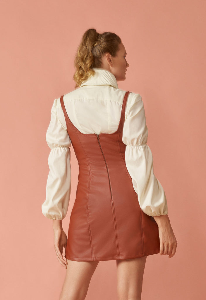 Back view of ivory button up blouse.