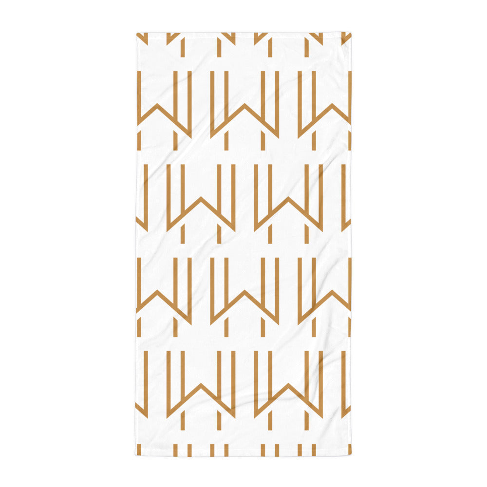 White terry cloth beach towel with gold Wadsworth House modern logo printed all over.